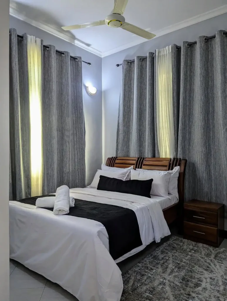A Black-and-White Bedroom With Hotel Appeal